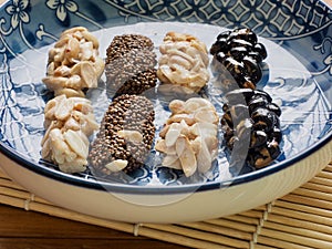 Korean traditional snacks SweetÂ RiceÂ PuffsÂ , Black sesame gangjeong, Peanut gangjeong